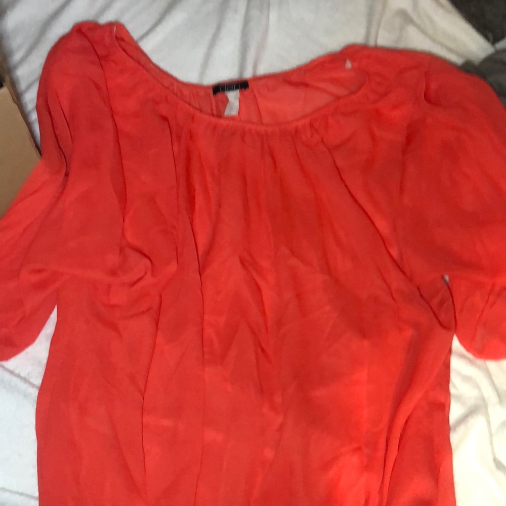 Sheer blouse looks good with any tank underneath